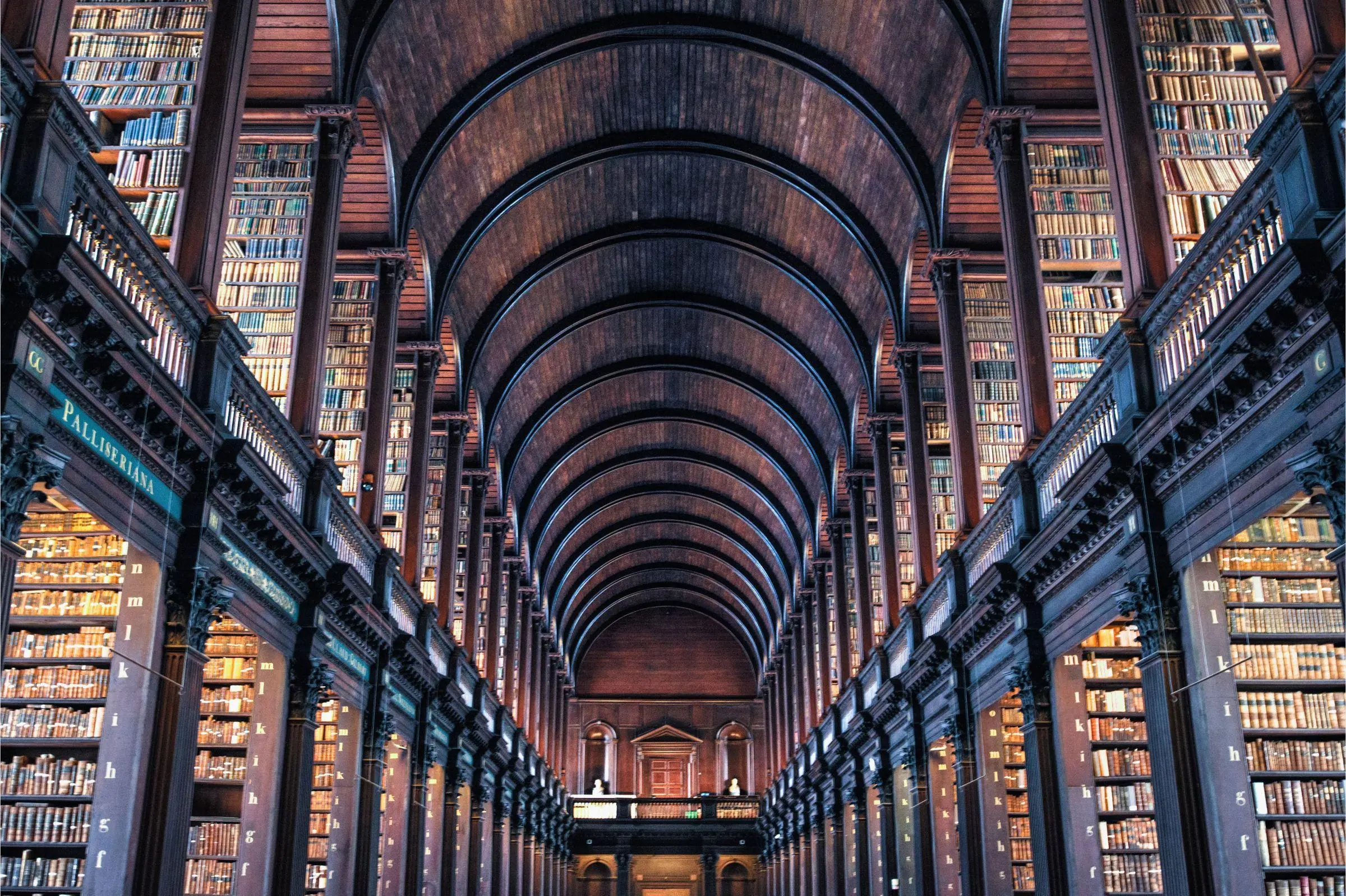The barrel-vaulted ceiling and wooden bookshelves of the Long Room in Trinity College Dublin