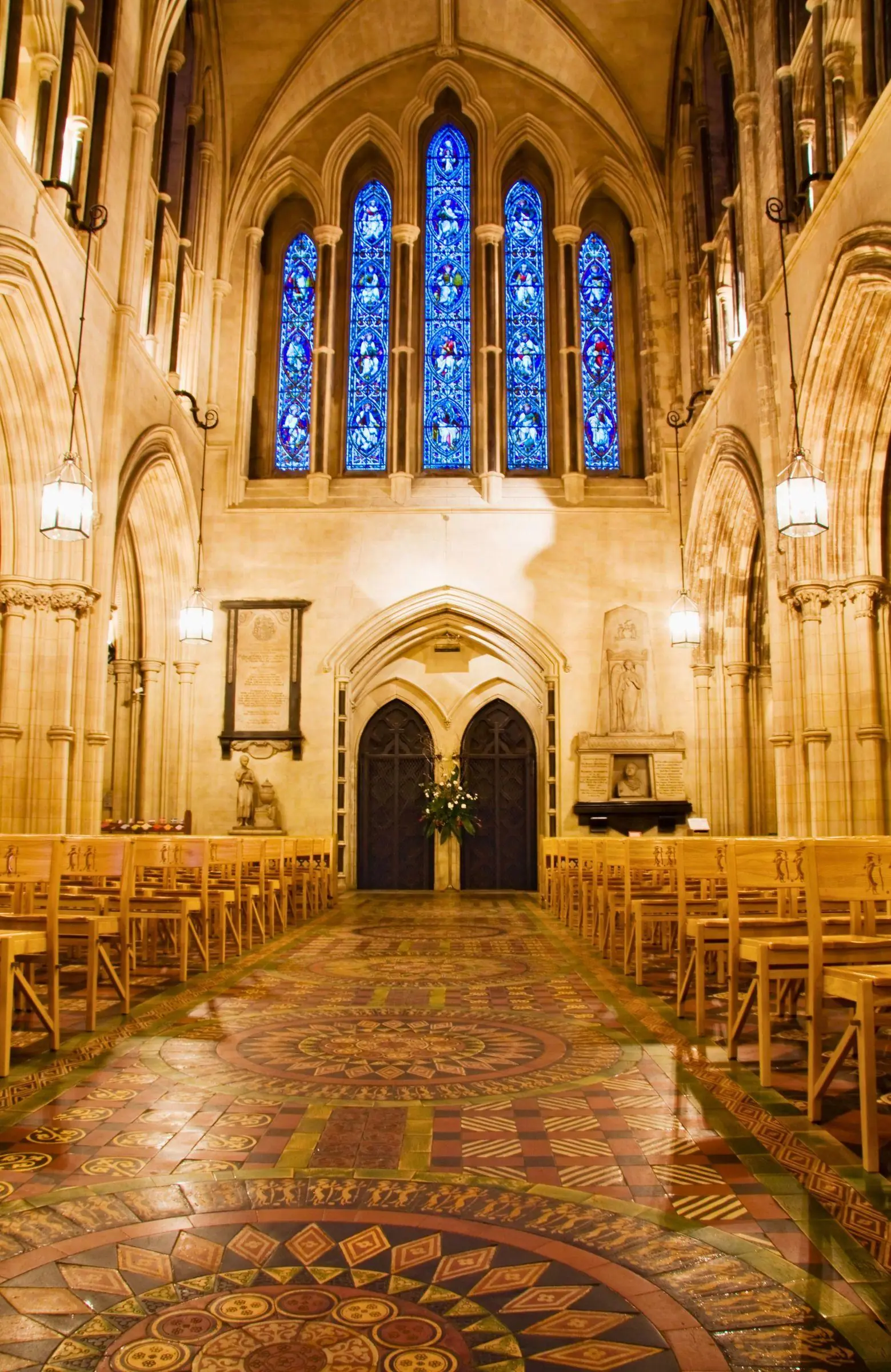 The patterned floor tiles and gothic arches inside Christ Church Cathedral