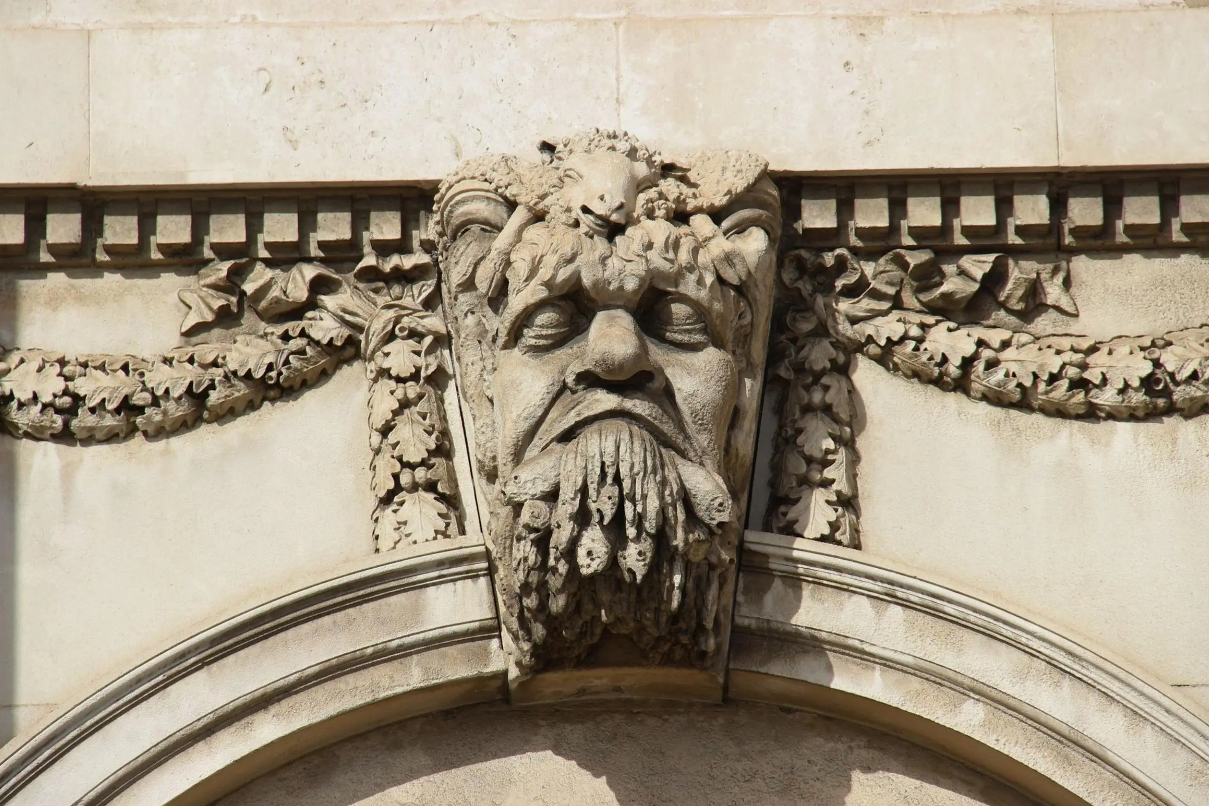 The Riverine Heads carved into the stone above the Custom House windows